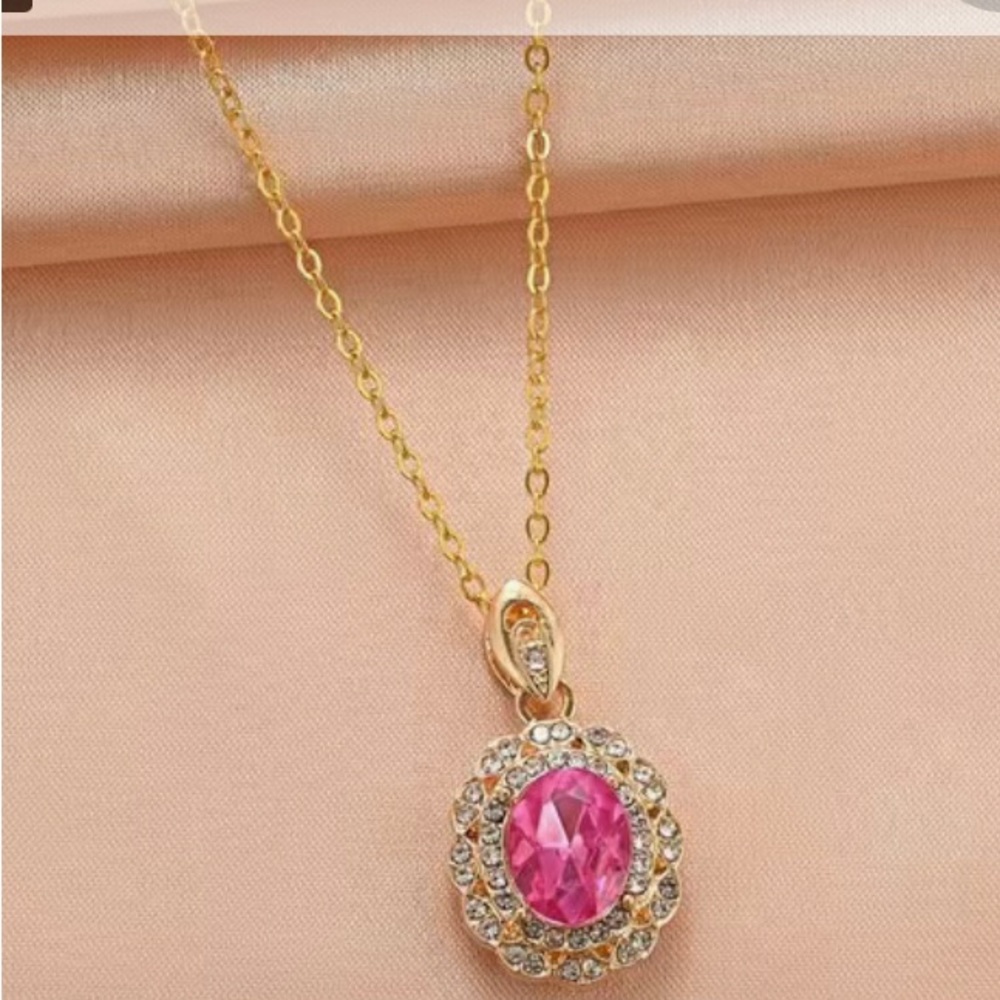 Women red stone necklace with stones around it